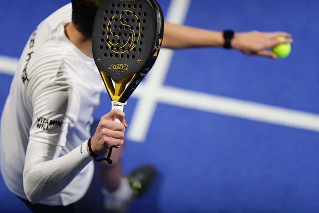 Male tennis player serving